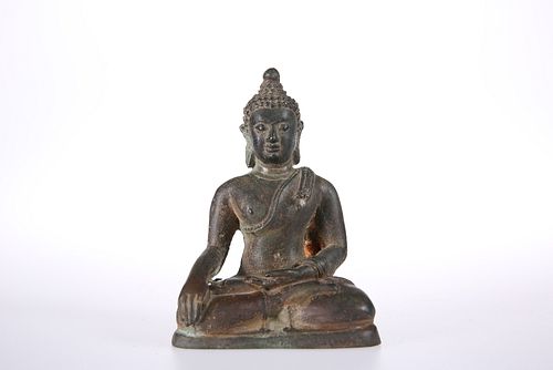 AN 18TH CENTURY BRONZE BUDDHA, seated in contemplative pose, wearing robes.