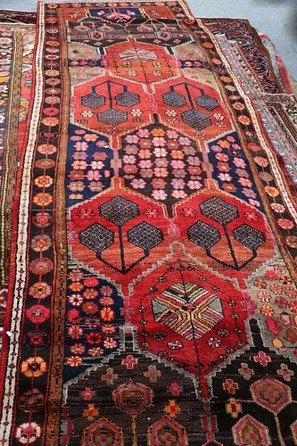 A LORI CARPET, with multiple elongated hexagonal medallions and decorated w