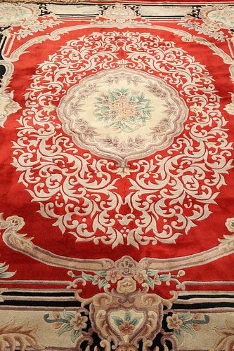 A LARGE CHINESE CARPET, with a red ground. 386cm by 266cm