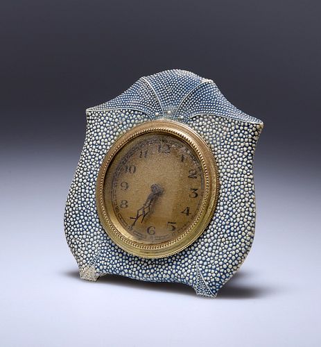A BLUE SHAGREEN DESK CLOCK, c. 1920, the circular gilt dial with Arabic num