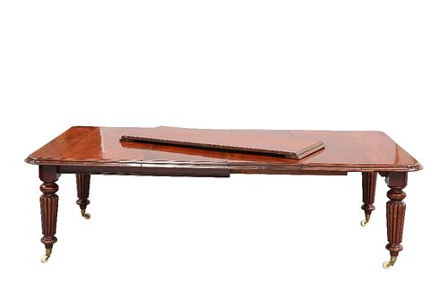 A VICTORIAN MAHOGANY WIND-OUT DINING TABLE, the moulded top with rounded co