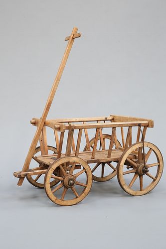 A VICTORIAN DOG CART, with iron-bound wheels.
