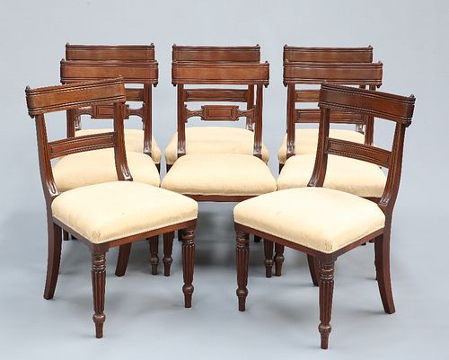 A HARLEQUIN SET OF EIGHT REGENCY MAHOGANY DINING CHAIRS, the bar backs with