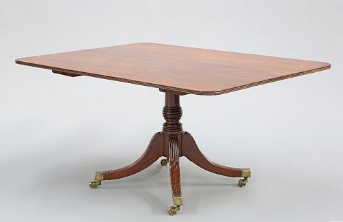 A REGENCY MAHOGANY TILT-TOP BREAKFAST TABLE, the rectangular top with reede