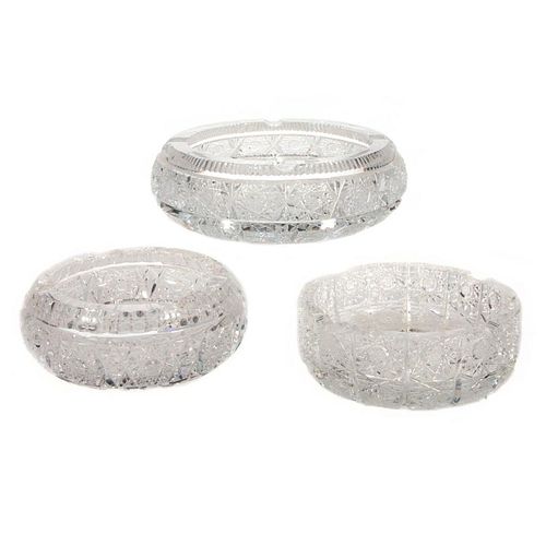 Three cut crystal ashtrays.