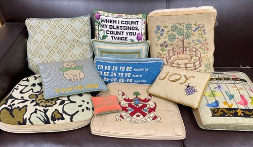 Collection of 11 embroidered pillows and seats
