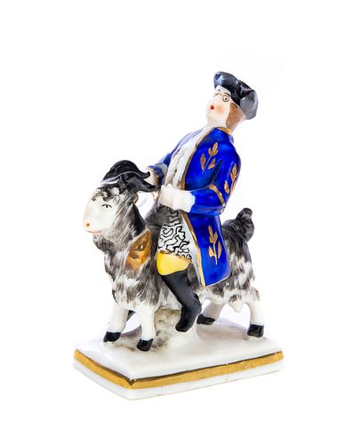 German Miniature Porcelain of Man Riding a Goat Gold