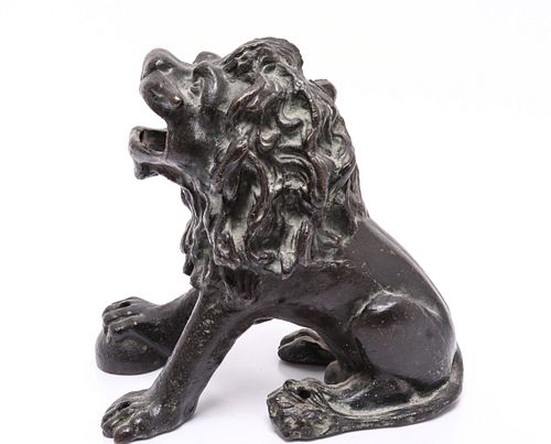 Cast Iron Model Of A Seated Lion