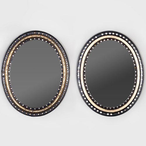 Two Similar Irish Ebonized Parcel-Gilt and Beaded Glass Oval Mirrors