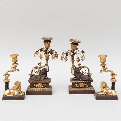 Pair of Regency Gilt-Metal-Mounted Lion Form Candlesticks and a Similar Pair of Candlesticks