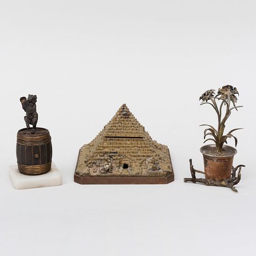 Gilt-Metal Pyramid Form Inkwell, Flower Pot Form Inkwell, and a Dancing Bear on a Barrel Match Strike