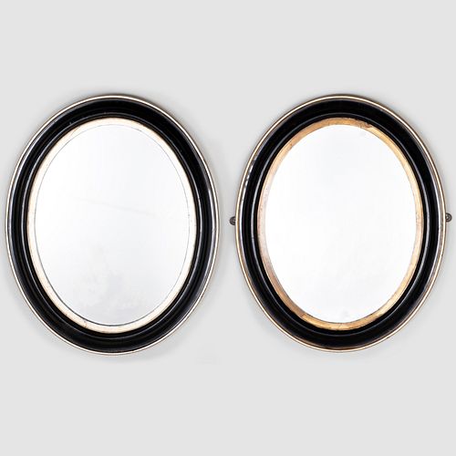 Two Similar Small Victorian Ebonized Parcel and Silver-Gilt Oval Mirrors