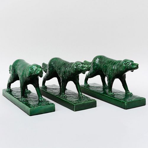 Three Green Glazed Ceramic Models of Pointing Spaniels