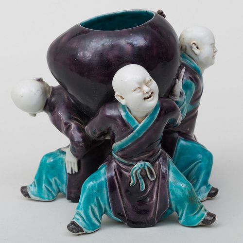 Chinese Turquoise and Aubergine Glazed Porcelain Boy and Peach Form Pot