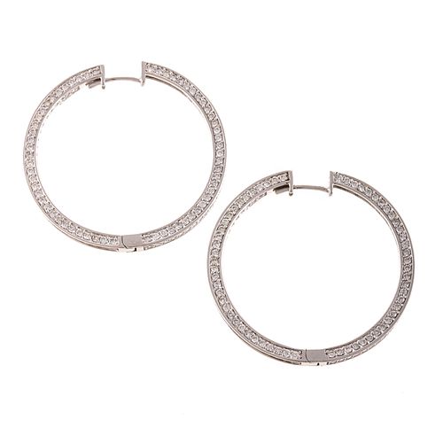 A Pair of Diamond Hoop Earrings in 14K