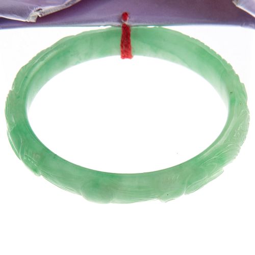 A Lady's Carved Natural Jade Bangle