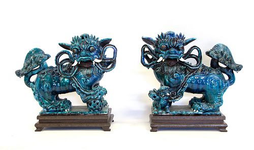 A Pair of Blue Flambe Glaze Foo Dogs.