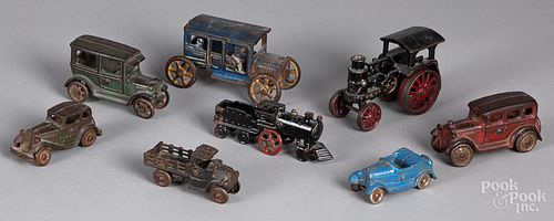 Eight small cast iron vehicles, etc.