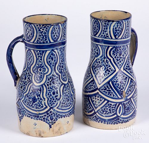 Two Continental blue and white pottery pitchers