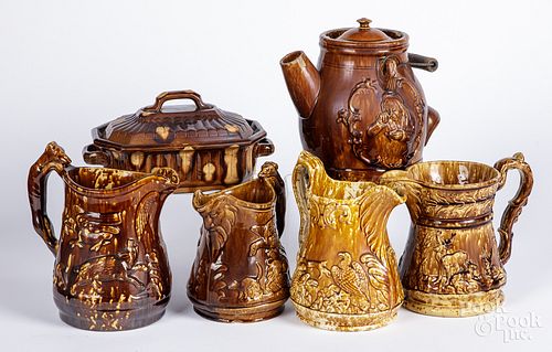 Four Rockingham pitchers, together with a jug