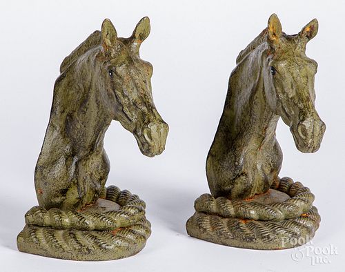 Pair of painted cast iron horsehead bookends.