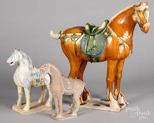 Three Chinese pottery horses.