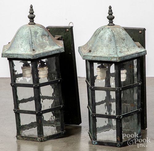 Pair of bronze architectural wall sconce lights.