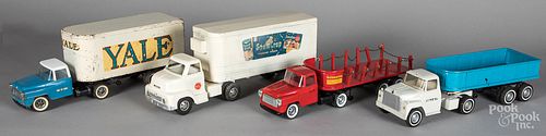 Four pressed steel tractor trailers