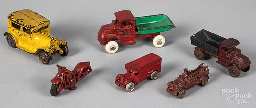 Six small cast iron vehicles