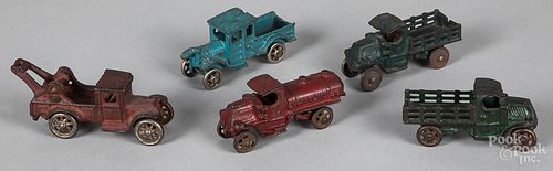 Five small cast iron vehicles