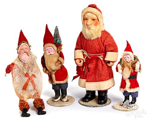 Four Santa Claus figures