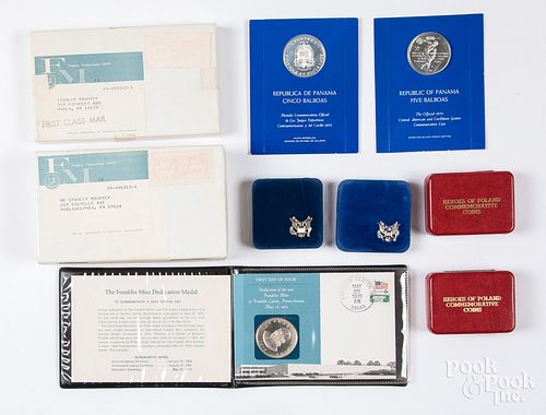 Ten silver dollars and commemorative coins.