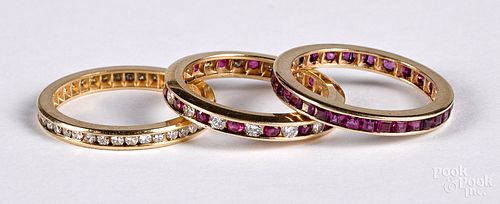 Three 14K gold, diamond and ruby channel set ring