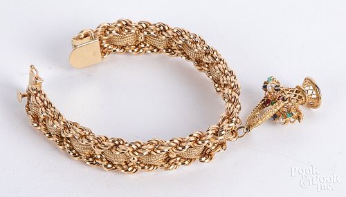 14K gold bracelet, with basket charm, 41.7 dwt.