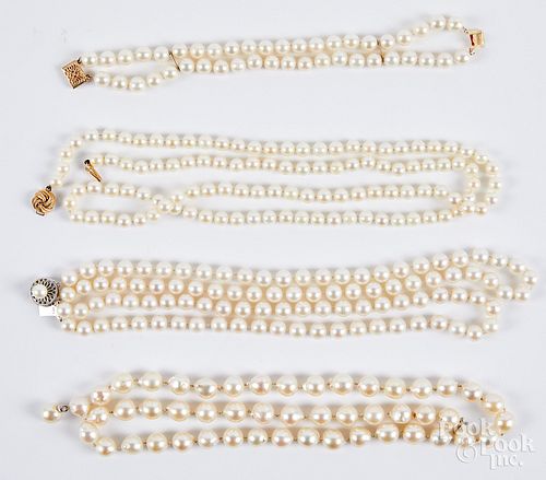 Three pearl necklaces and a bracelet