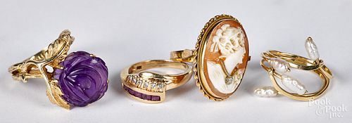 Four 14K gold and gemstone rings, 10.9 dwt.