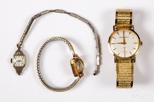 Three 14K gold wristwatches, with plated bands.