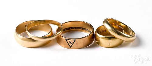 Five 14K yellow gold wedding bands