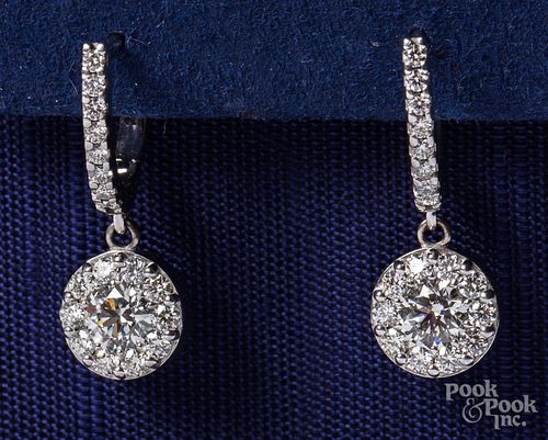 18K white gold and diamond drop earrings.