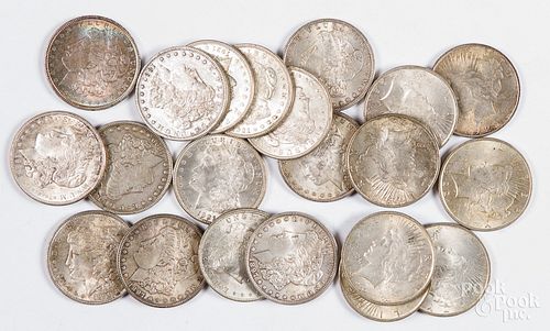 Twenty-one silver dollars