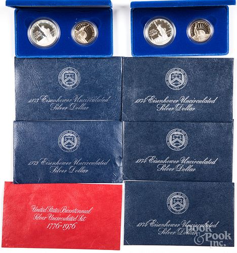 Twelve uncirculated Eisenhower silver dollars, et