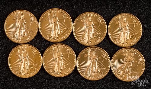 Eight 1/4 ozt. fine gold coins.