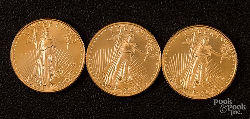 Three 1/4 ozt. fine gold coins.