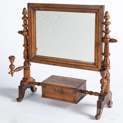 Walnut shaving mirror, 19th c., with candlearms