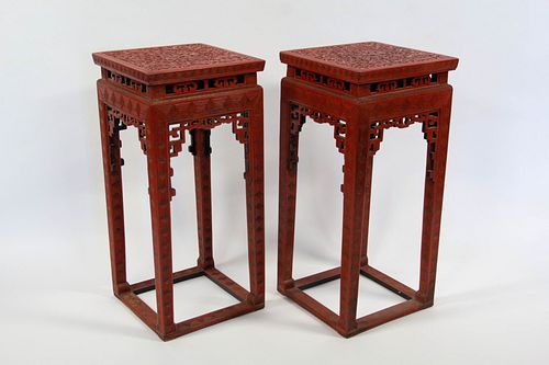 A Pair of Carved Cinnabar 'Dragon' Incense Stands.