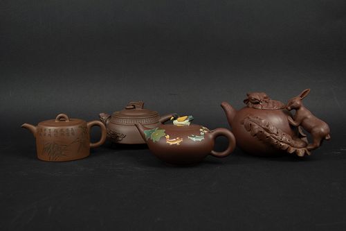 Group of Four Yixing Teapots.