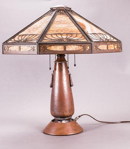An Arts and Crafts Hammered Copper Table Lamp with a Faceted Eight Panel Slag Glass Shade, 20th Century, Unmarked and rewired. Four sockets. Base dime