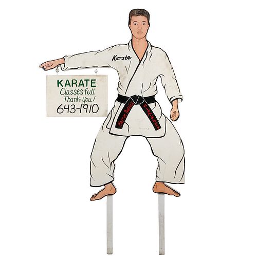 Kitschy life-size karate dojo trade sign