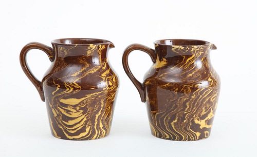 TWO ENGLISH BROWN POTTERY YELLOW-MARBLESIZED JUGS