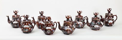 COLLECTION OF THIRTEEN VICTORIAN MEASHAM POTTERY BARGEWARE TEAPOTS AND COVERS